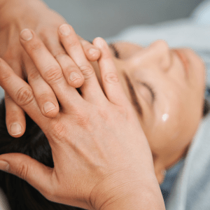 A woman receiving a soothing facial massage