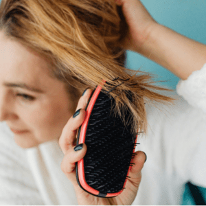 woman brushing her hair